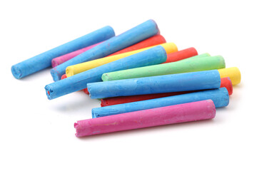 chalks in a variety of colors arranged on a white background