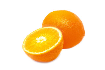 Slieced and whole fresh tropical oranges on white background
