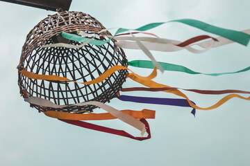 Hanging lamp made with bamboo chicken coop, Thai traditional style, with beautiful rag in various colours.