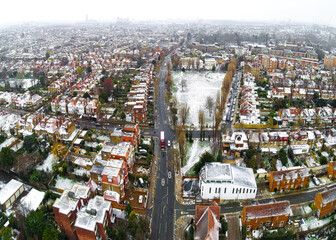 Aerial view of snowy London suburb in winter