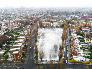 Aerial view of snowy London suburb in winter