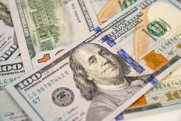 100 American dollars. background from banknotes. the concept of investment and expenditure. Taxes. gambling and lotteries.