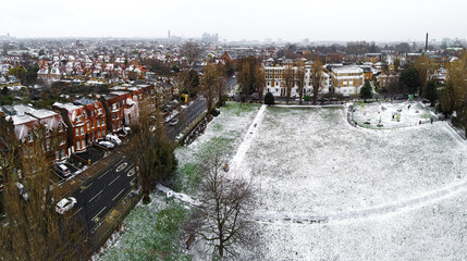Aerial view of snowy London suburb in winter