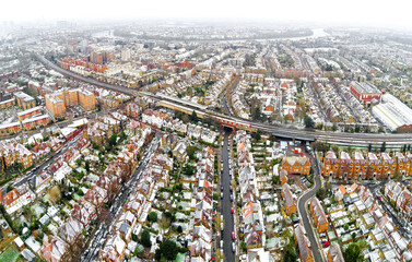 Aerial view of snowy London suburb in winter