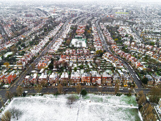Aerial view of snowy London suburb in winter