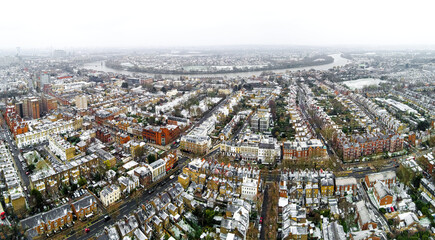Aerial view of snowy London suburb in winter