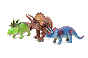 dinosaurs toys on white background