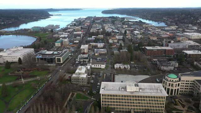Cinematic aerial drone footage of downtown Olympia, Washington State department buildings, East Campus plaza, capitol building campus area and offices near the historic district of Olympia, Washington