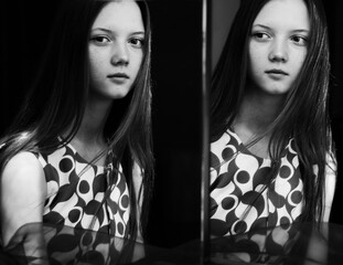 portrait of a young woman in black background
