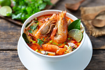 Tom Yam Kung ,Prawn and lemon soup with mushrooms, thai food in white bowl top view