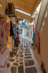 Tourist shops at a narrow street in the old town of Mykonos, Greece