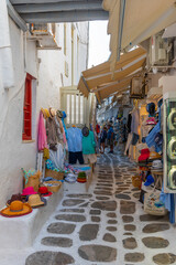 Tourist shops at a narrow street in the old town of Mykonos, Greece