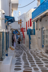 Tourist shops at a narrow street in the old town of Mykonos, Greece
