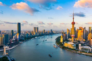 Selbstklebende Fototapeten Aerial view of Shanghai skyline at sunset,China. © ABCDstock