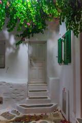 Night view of a white street in the old town of Mykonos, Greece