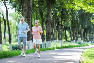  Old couple jogging in outdoor park © eastfenceimage