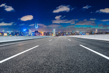 Fototapeta na wymiar Empty asphalt road and Shanghai skyline with buildings at night.