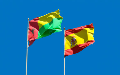Flags of Spain and Guinea-Bissau.