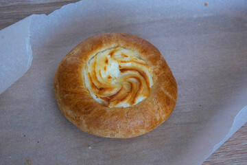 bun with cottage cheese on paper