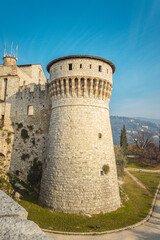 Fototapeta na wymiar View of the Observation tower from the lower tier of the castle of Brescia city. Lombardy. The Falcon of Italy, one of the largest fortified complexes with 75,000 square metres enclosed within walls