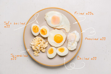 Plate with different delicious egg recipes on light background