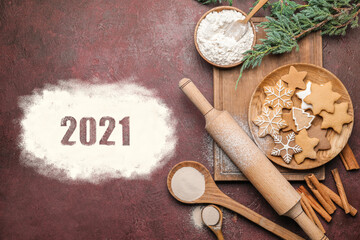 Fototapeta na wymiar New Year composition with cookies and rolling pin on color background