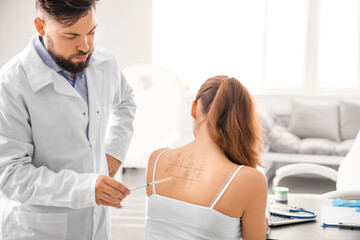 Fototapeta premium Young woman undergoing allergen skin test in clinic