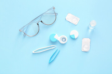 Composition with contact lenses and accessories on color background