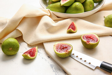 Fresh green figs on light background