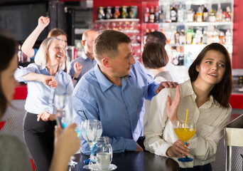 Portrait of woman rejecting man on corporate party