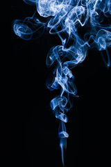 Cigarette smoke on dark background