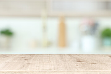 empty table board and defocused modern kitchen background. product display concept
