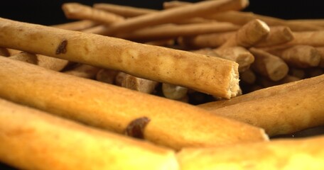 Thin and Crunchy Italian Breadsticks. Light-as-air, pencil-thin Italian breadsticks. Concept for restaurants. High quality photo.