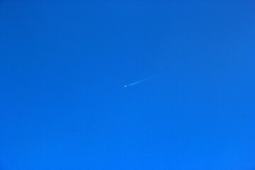 a plane flying high in the sky