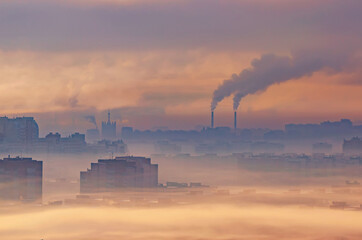 Urban industrial landscape, residential buildings buried in smoke and smog, chemical plants emit...