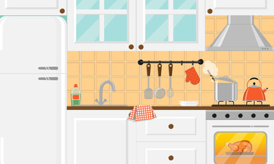 Cozy kitchen with white furniture and food on gas stove and inside the oven.