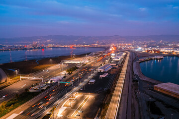 Aerial view of freeways in San Francisco Bay during rush hour at dusk