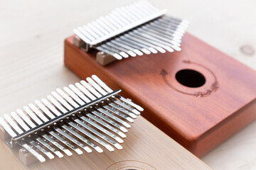 e Kalimba is a popular small wooden musical instrument that is light and easy to carry around as it doesn't require electricity.