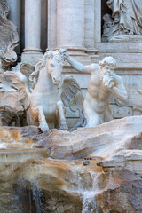 18th century Trevi Fountain, character of triton with a horse, Rome, Italy