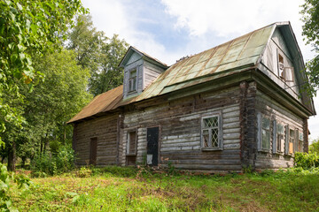 Fototapeta na wymiar Old wooden abandoned house on a hill