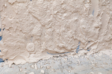 Wall covered with plaster as an abstract background.