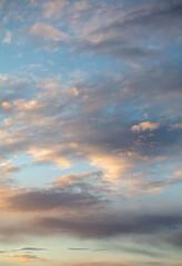 Naklejka na ściany i meble Rain clouds in the sky at sunset