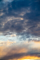 Rain clouds in the sky at sunset