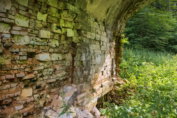 Under the Big white stone bridge in the park of the Serednikovo estate on a summer day