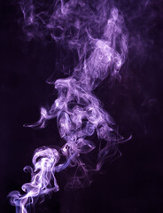Fototapeta premium Purple smoke isolated on black background. Abstraction