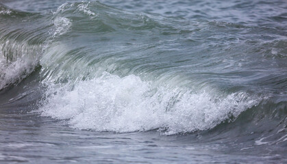 Wave in the sea with splashing water.