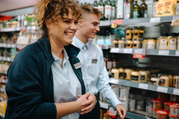 Supermarket manager with new employee