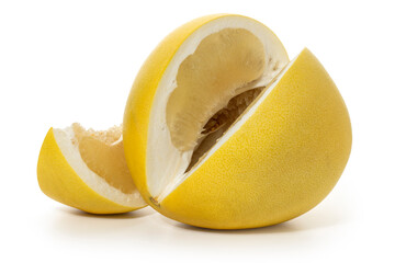Large ripe pomelo fruit with a cut out piece on a white background. Full depth of field. With clipping path