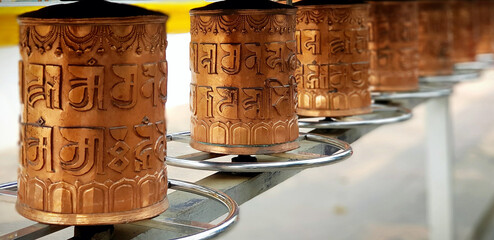 Series of prayer wheels at Buddha temple