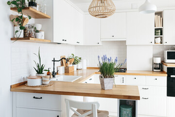 Blue muscari flower on white modern kitchen scandinavian style.